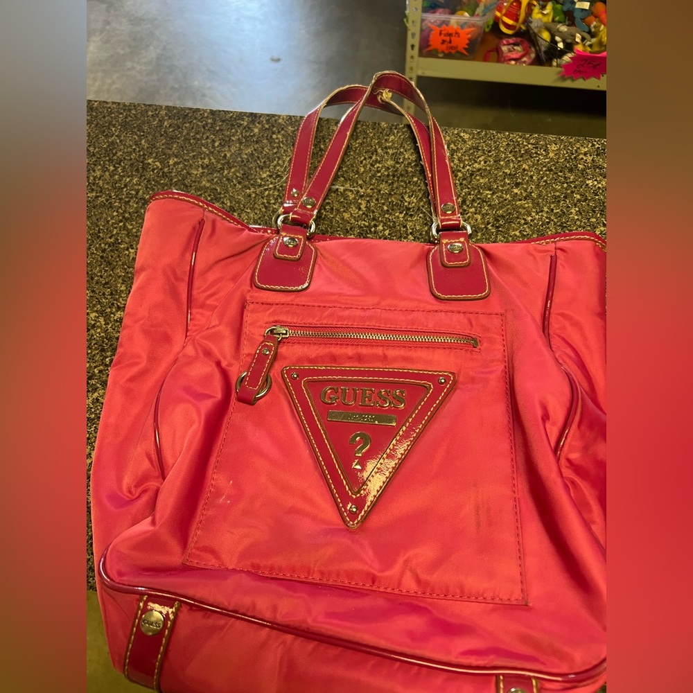 Guess, pink purse, has a few stains, and used